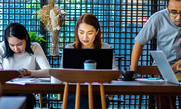 women working on a laptop